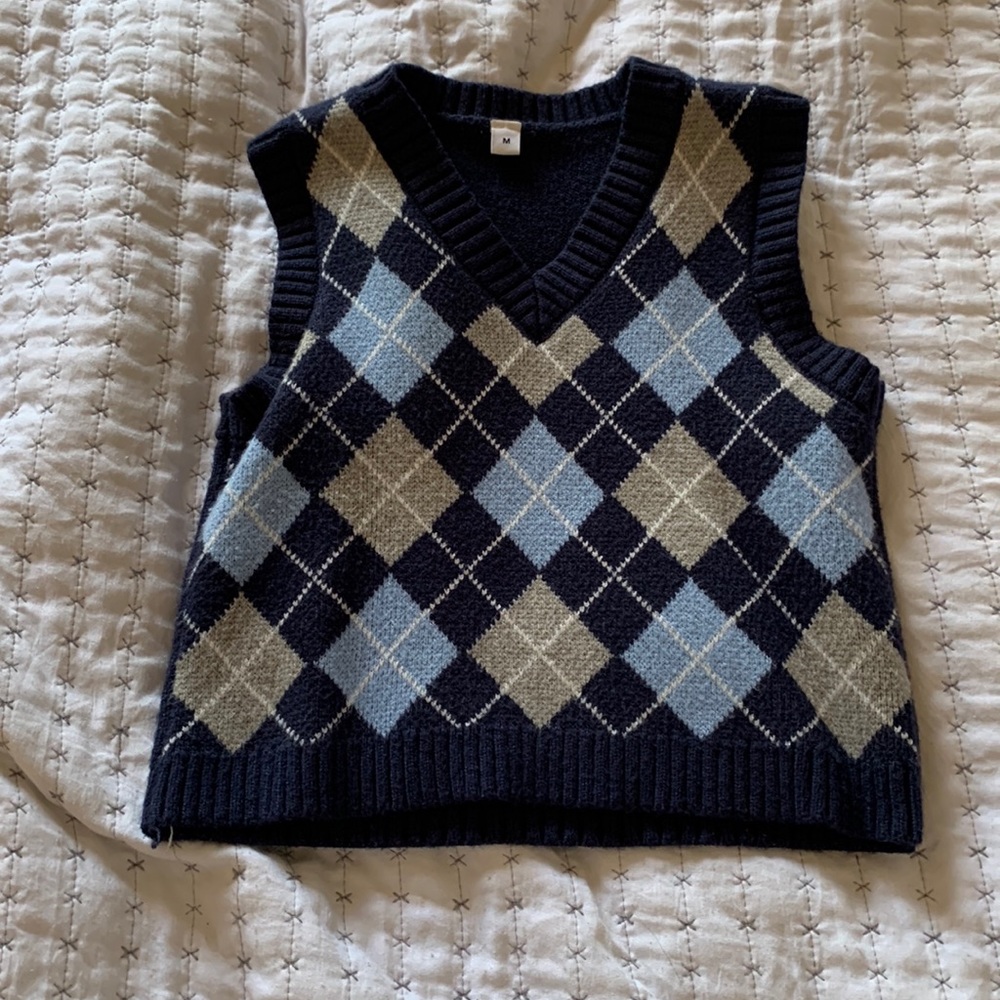 A navy blue sweater vest